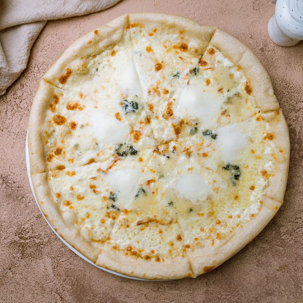Pizza mi-chèvre, mi-vache (4 fromages)